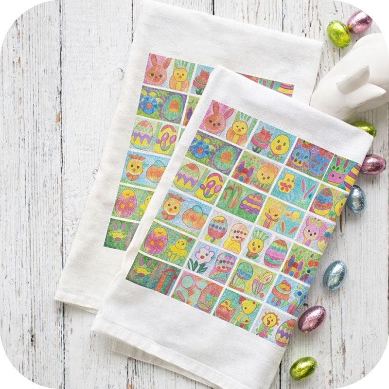 Tea towels with a collage of children's artwork printed all over them.